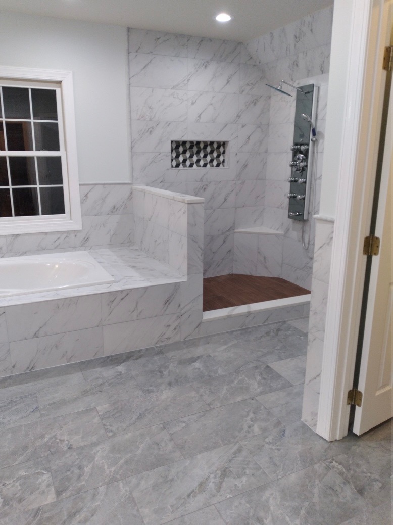 Marble master bathroom with soaking tub